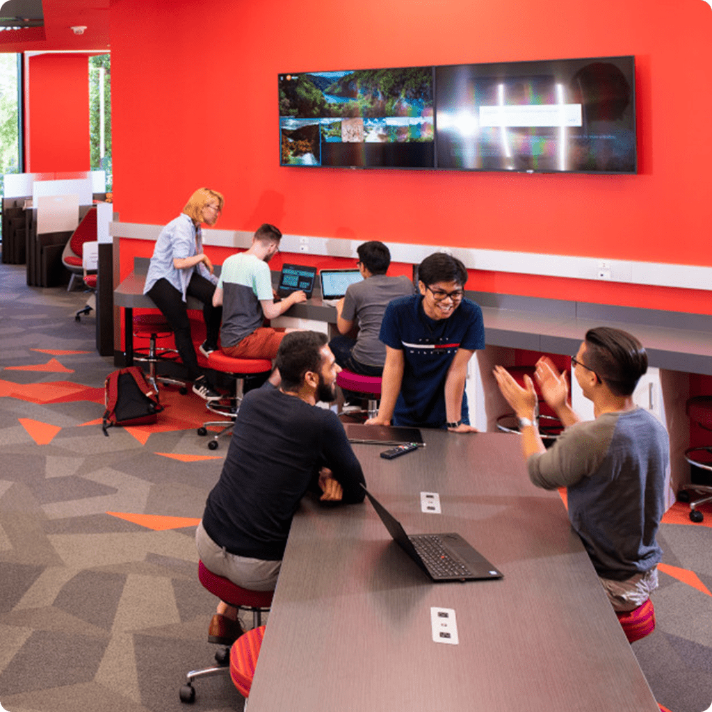 Students working in groups in an open space of the Student Innovation Centre at U of A.